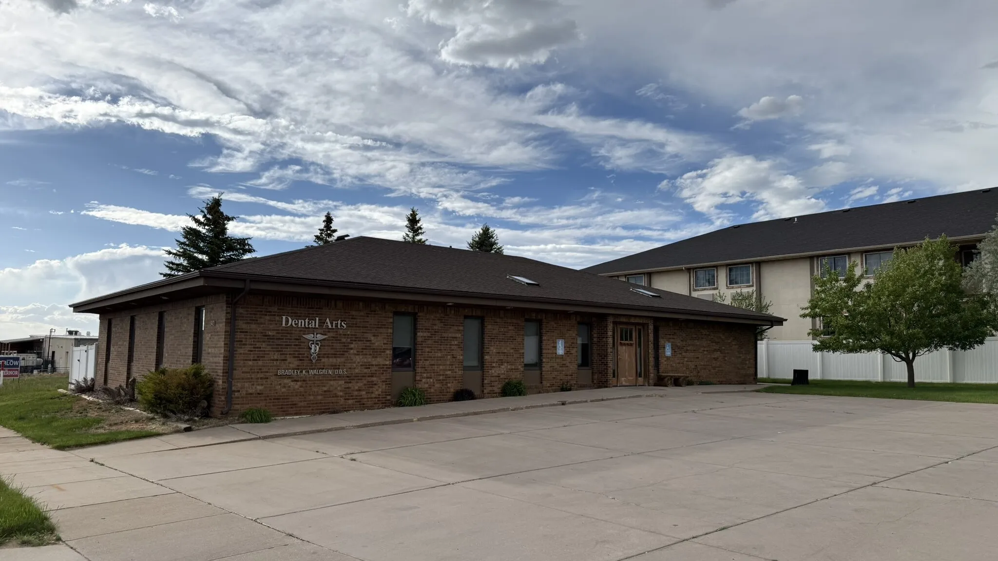 The Walgren Dental Arts office, a single-story brick building on East Garfield Street in Laramie